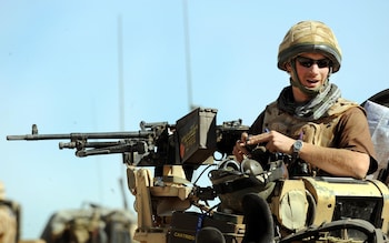 Prince Harry sitting in a Spartan armoured vehicle in Helmand province in 2008