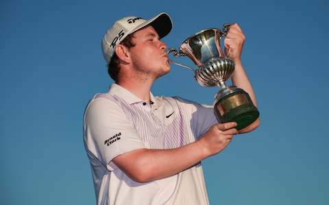Robert MacIntyre of Scotland celebrates with the trophy after winning The Italian Open on Day Four of the DS Automobiles Italian Open 2022 at Marco Simone Golf Club 