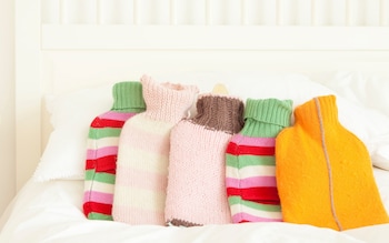 A row of 5 hot water bottles