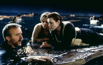 Turmoil and tears: Kate Winslet, pictured with director James Cameron (left) and Leonardo DiCaprio (middle), was afraid of drowning during underwater scenes
