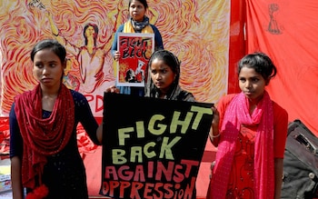 Activists of the Progressive Democratic Students Federation (PDSF) hold placards and banners as they join a demonstration within the 'Stop Rape Culture' campaign, in Kolkata, India, 16 December 2022