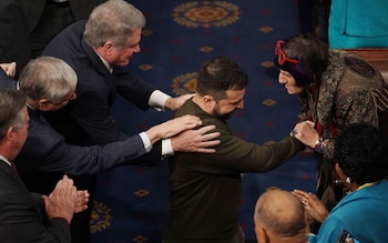Volodymyr Zelensky is greeted as he arrives to deliver an address to a joint meeting of the United States Congress 