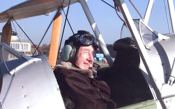 Bill Stevens in a Tiger Moth on his 100th birthday