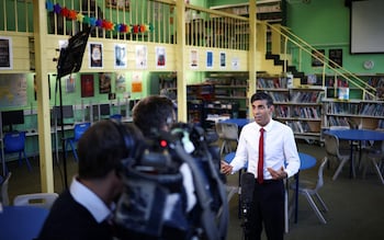 Rishi Sunak speaks during a televion media interview during his visit to a secondary school in south west London