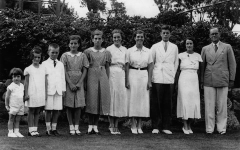 The Kennedy clan: Rosemary (fourth from right) standing next to her brother, the future president of the United States John F Kennedy (third from right)