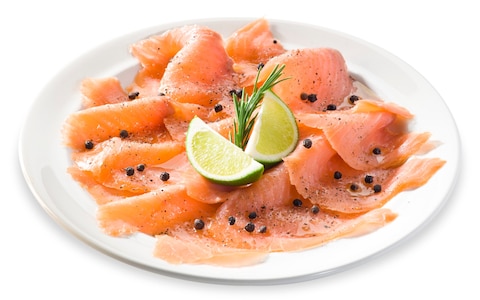 plate of smoked salmon with cracked pepper