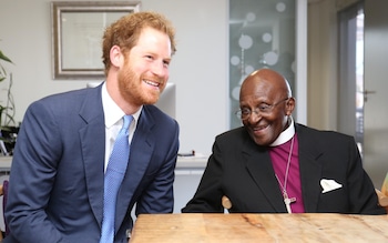 The Duke of Sussex says in his book Spare that he 'wasn't religious'. Here he is seen meeting Desmond Tutu in 2015