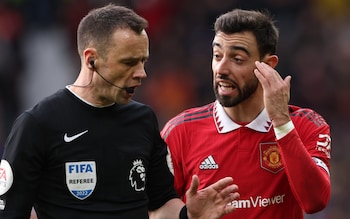 Bruno Fernandes of Manchester United talks to Referee Stuart Atwell during the Premier League match between Manchester United and Manchester City