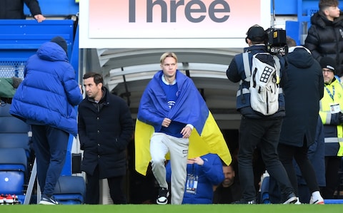 Mykhaylo Mudryk is introduced to Chelsea fans draped in the flag of Ukraine
