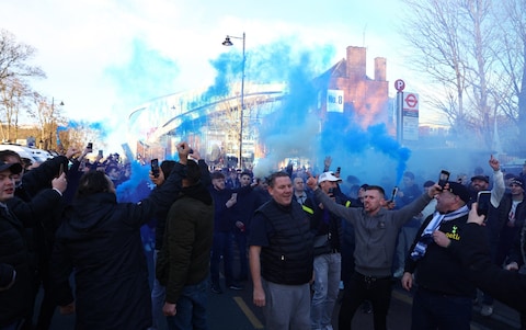 Tottenham Hotspur fans with flares outside the stadium before the match