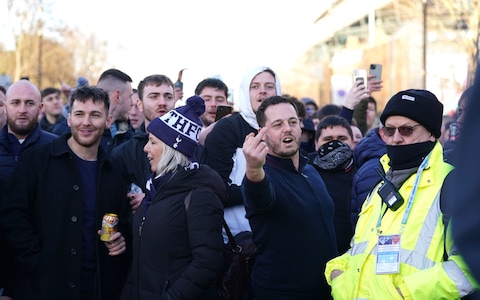 Tottenham Hotspurs fans gather outside before the Premier League match at the Tottenham Hotspur Stadium