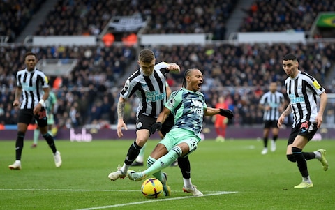 Kieran Trippier of Newcastle United fouls Bobby Reid of Fulham in the box which leads to a penalty for Fulham after a VAR check during the Premier League match between Newcastle United and Fulham FC - Last-gasp Newcastle make Fulham pay for Aleksandar Mitrovic's double-hit penalty blunder